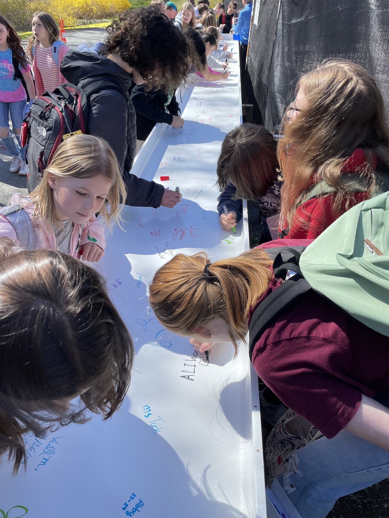 Landmark students sign beam_3