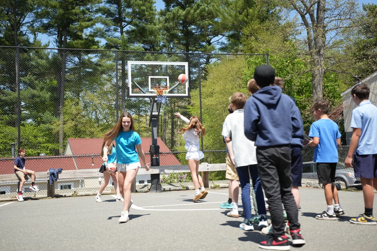middle school students playing basketball