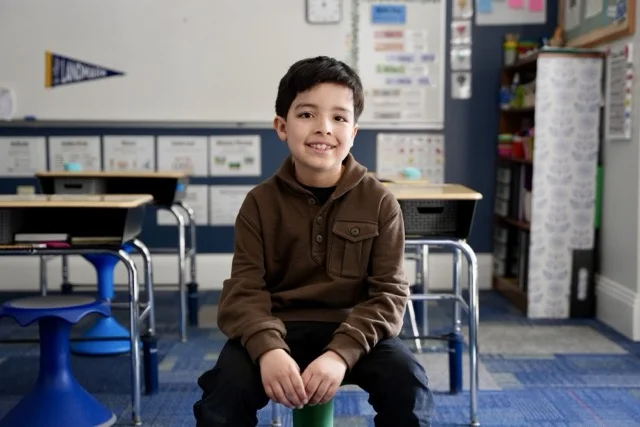 elementary school student looking at camera