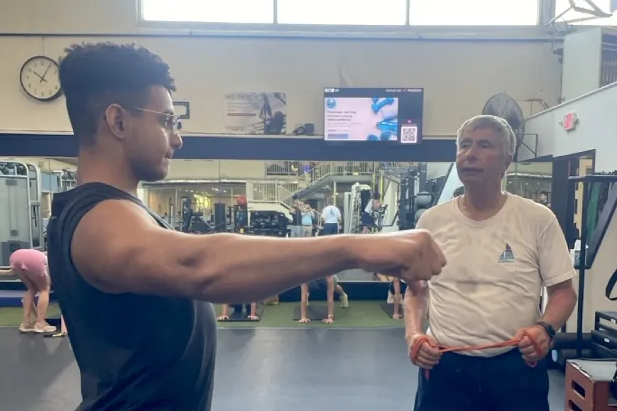 Landmark senior working in capstone project as personal trainer