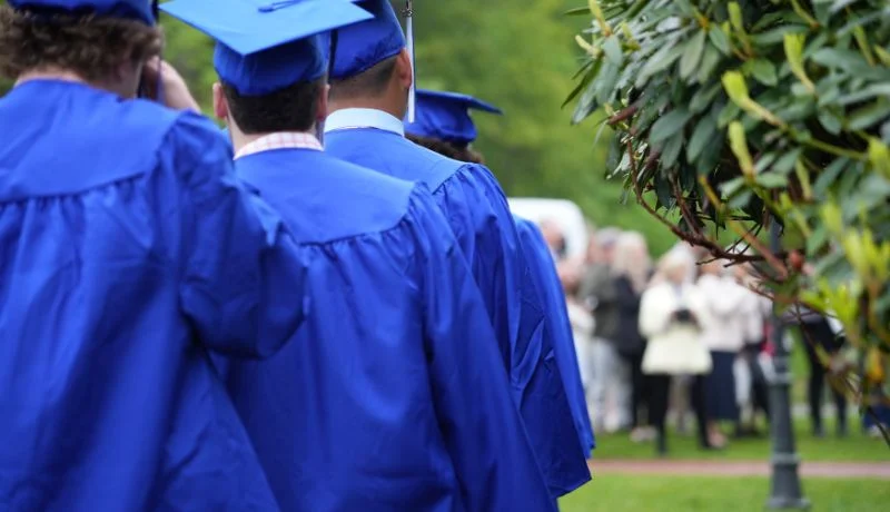 students in graduation cap and gowns