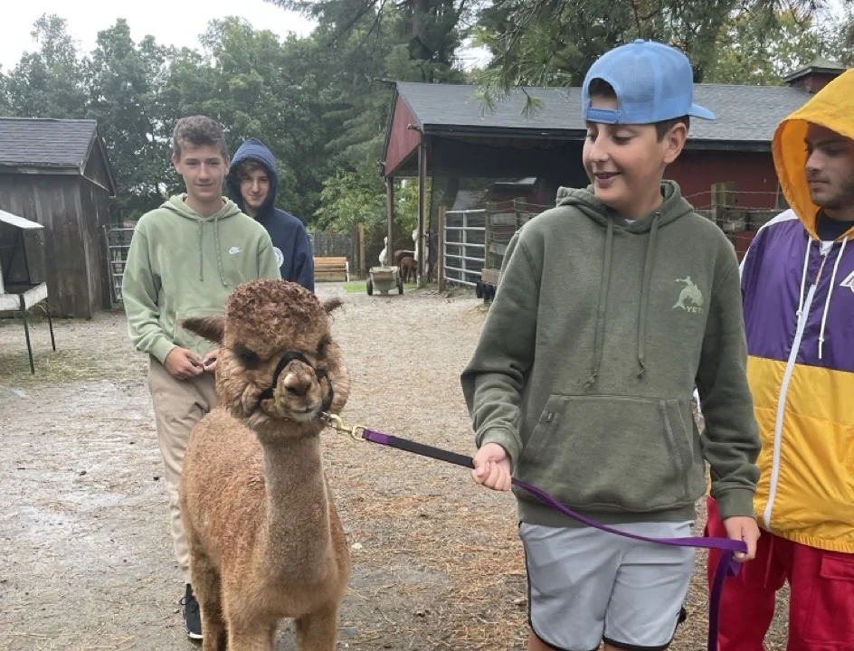 students learning out in the real world during saturday school at a farm