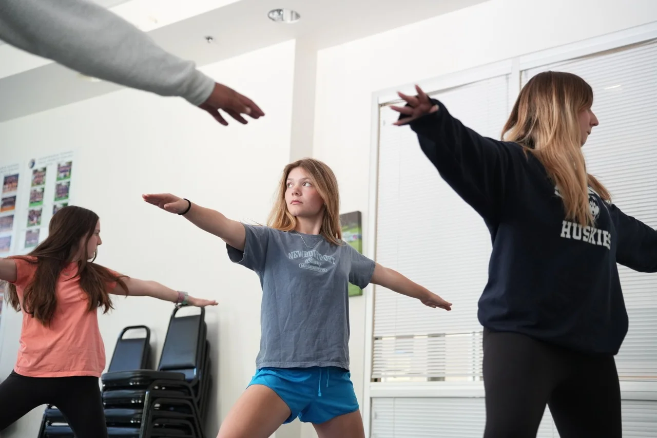 students doing yoga