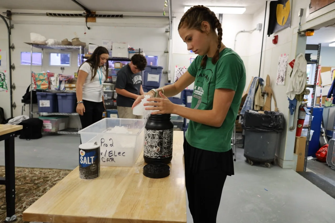 middle school student conducting a steam experiment