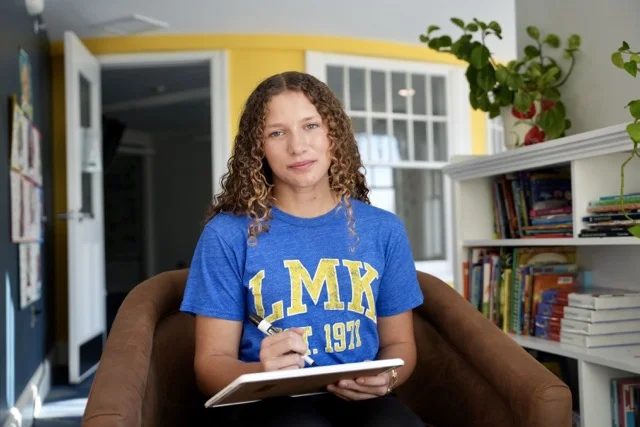 middle school student looking at camera