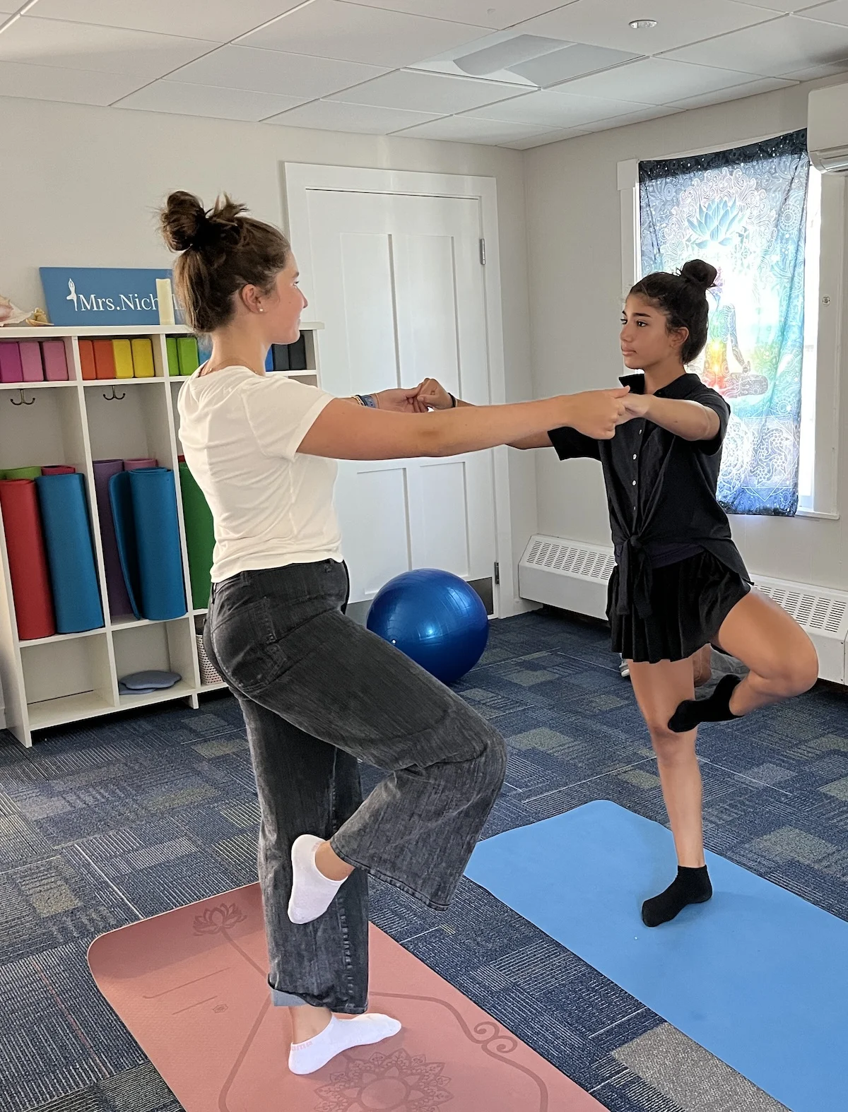 middle school girls doing yoga