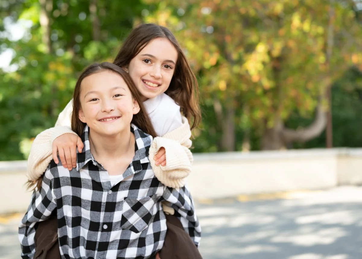 two girls smiling