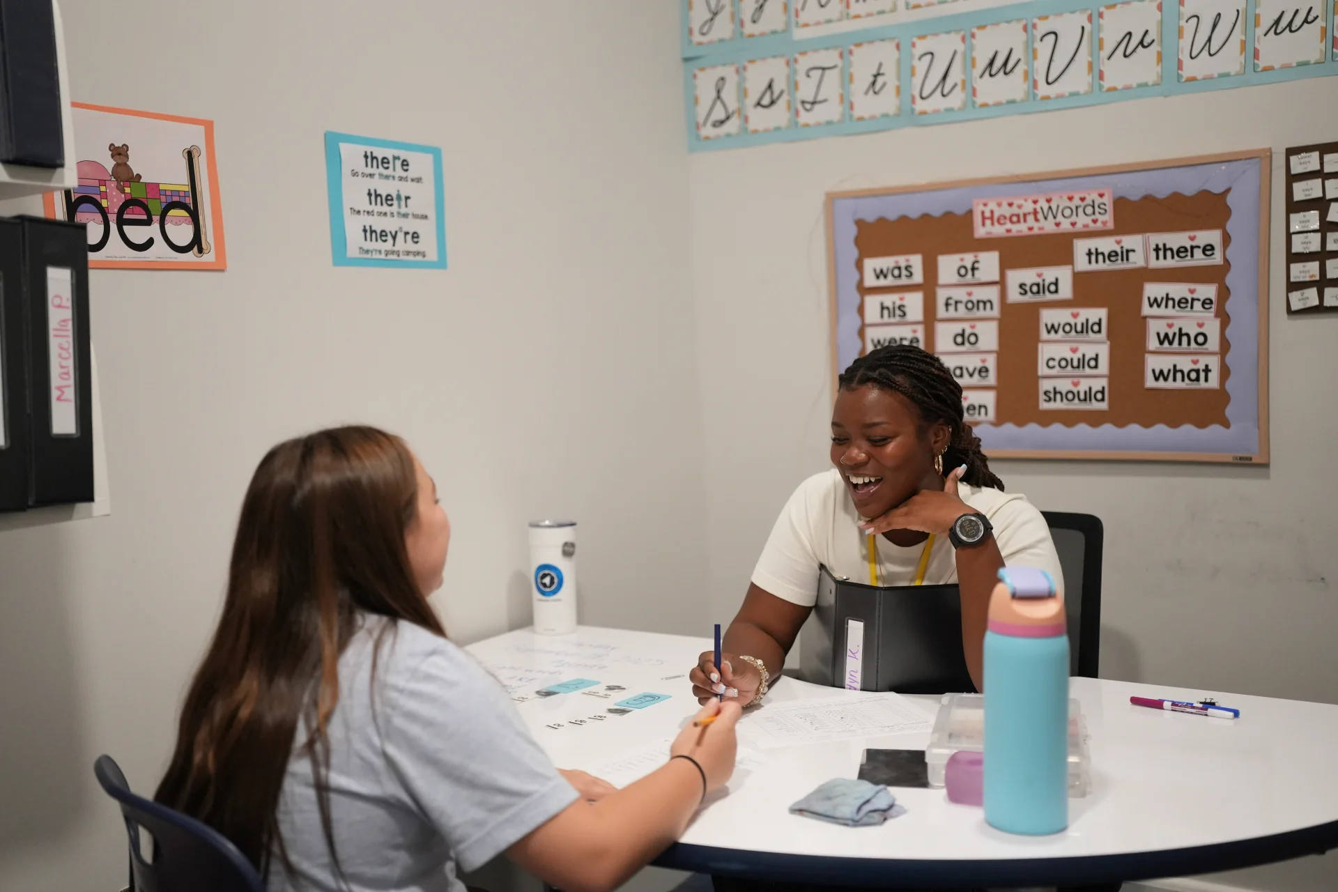 teacher and student working on literacy skills in tutorial