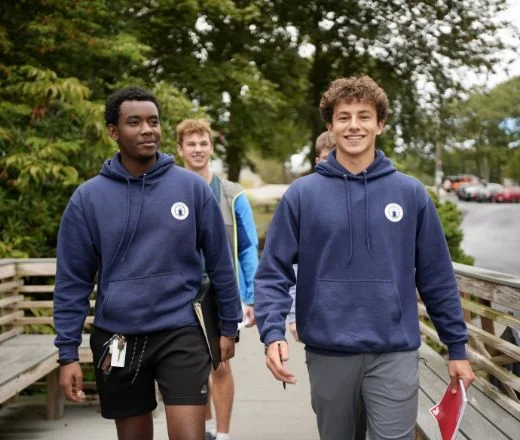 high school boys walking across campus