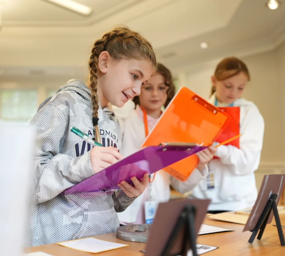 students with colorful clipboards