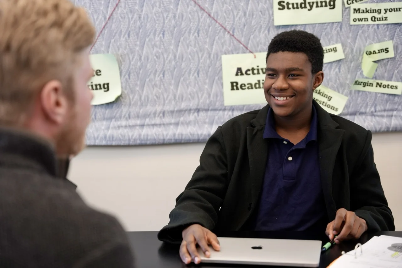 student with study skill terms behind him