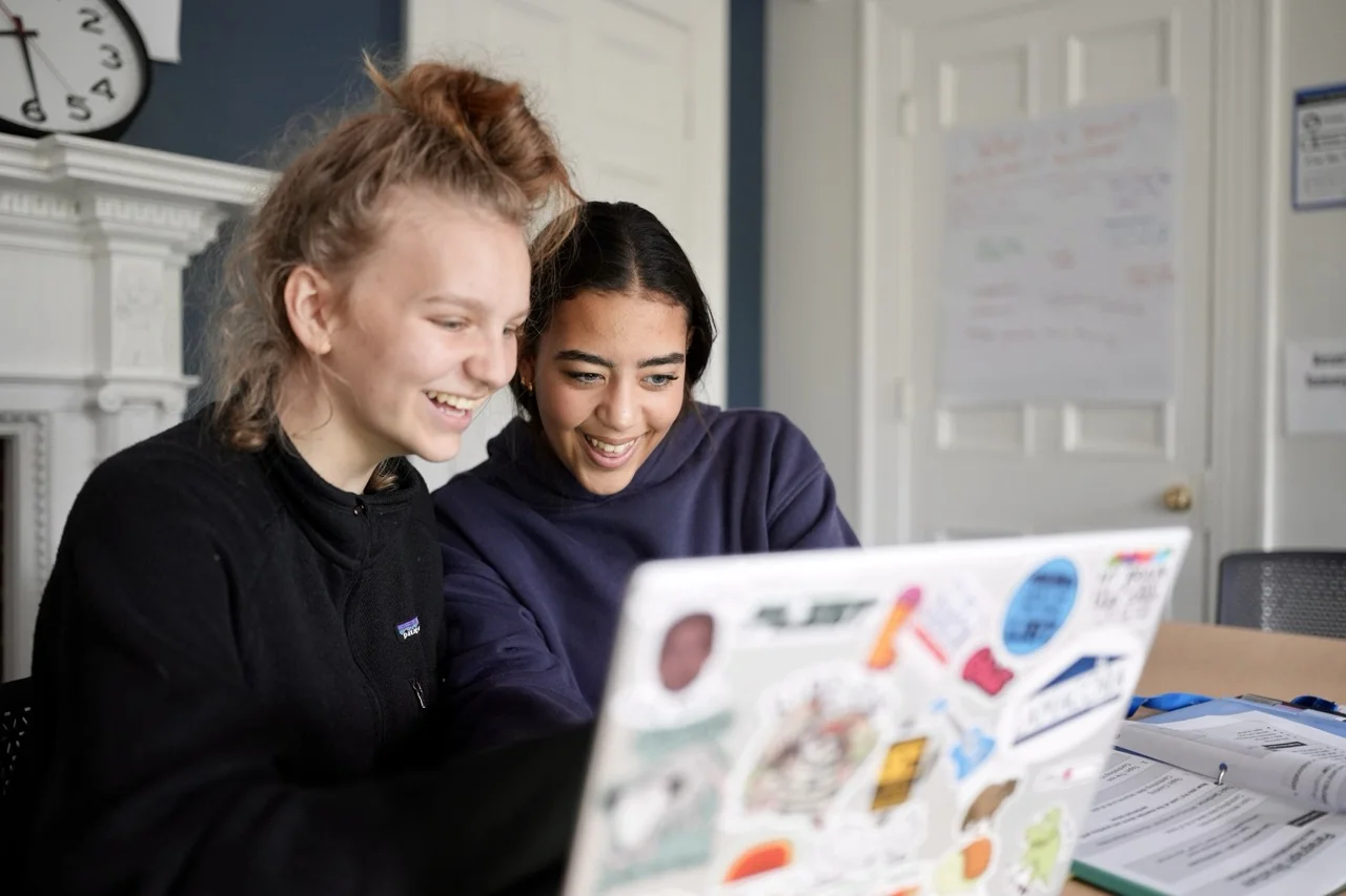 students working together on project using a computer