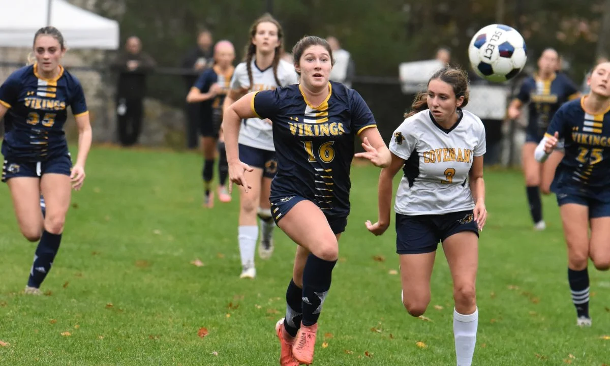 soccer team running for ball