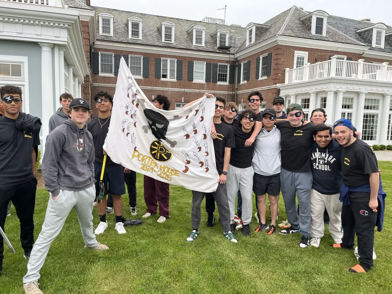 boys from Porter Dorm hold up sign
