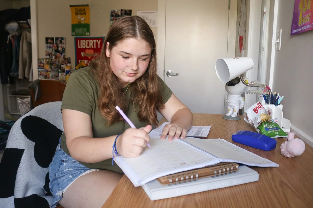 student using planner to prepare
