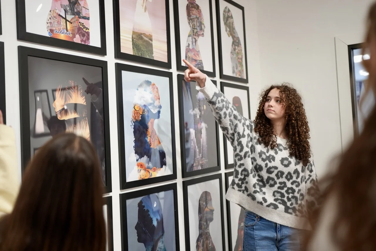 visual arts student working on literacy and communication skills by presenting her work to peers and accepting critic