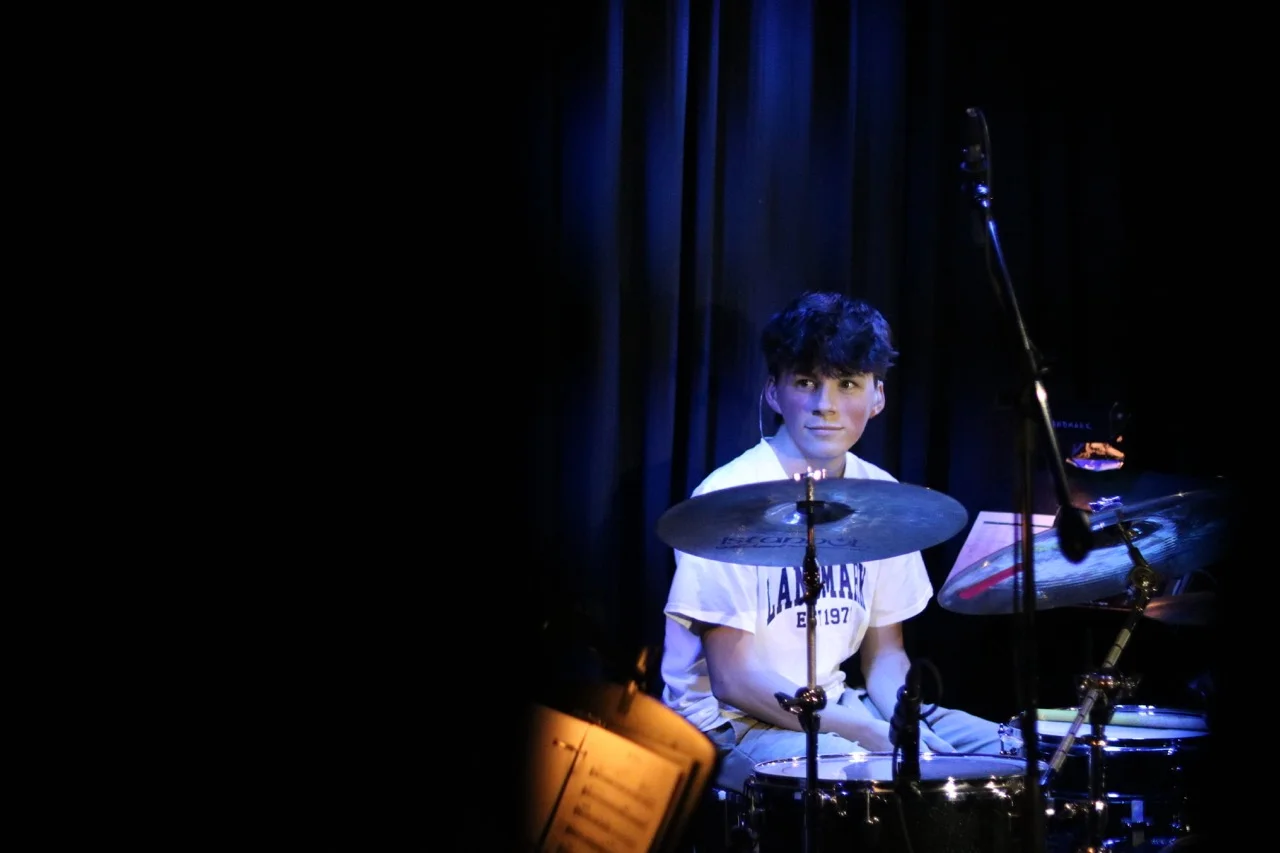 boy playing drums in music
