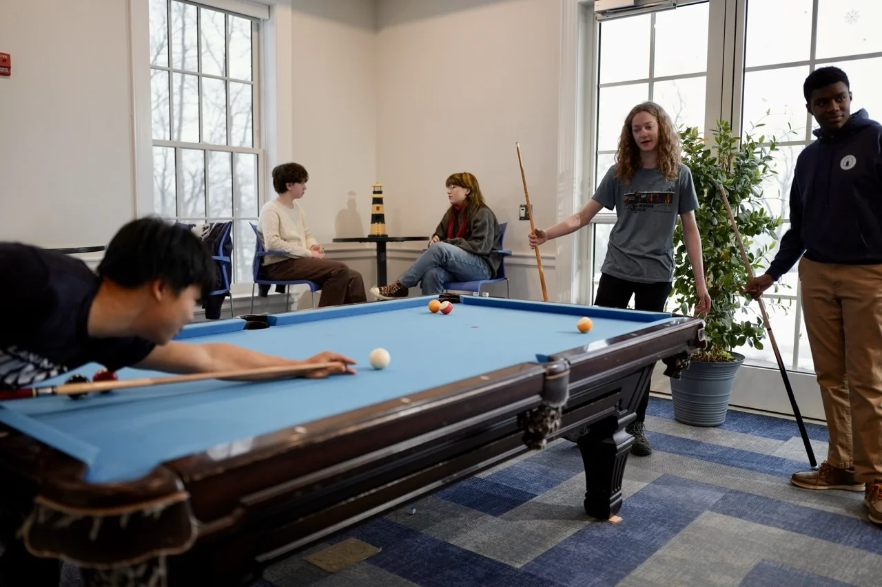 students playing pool