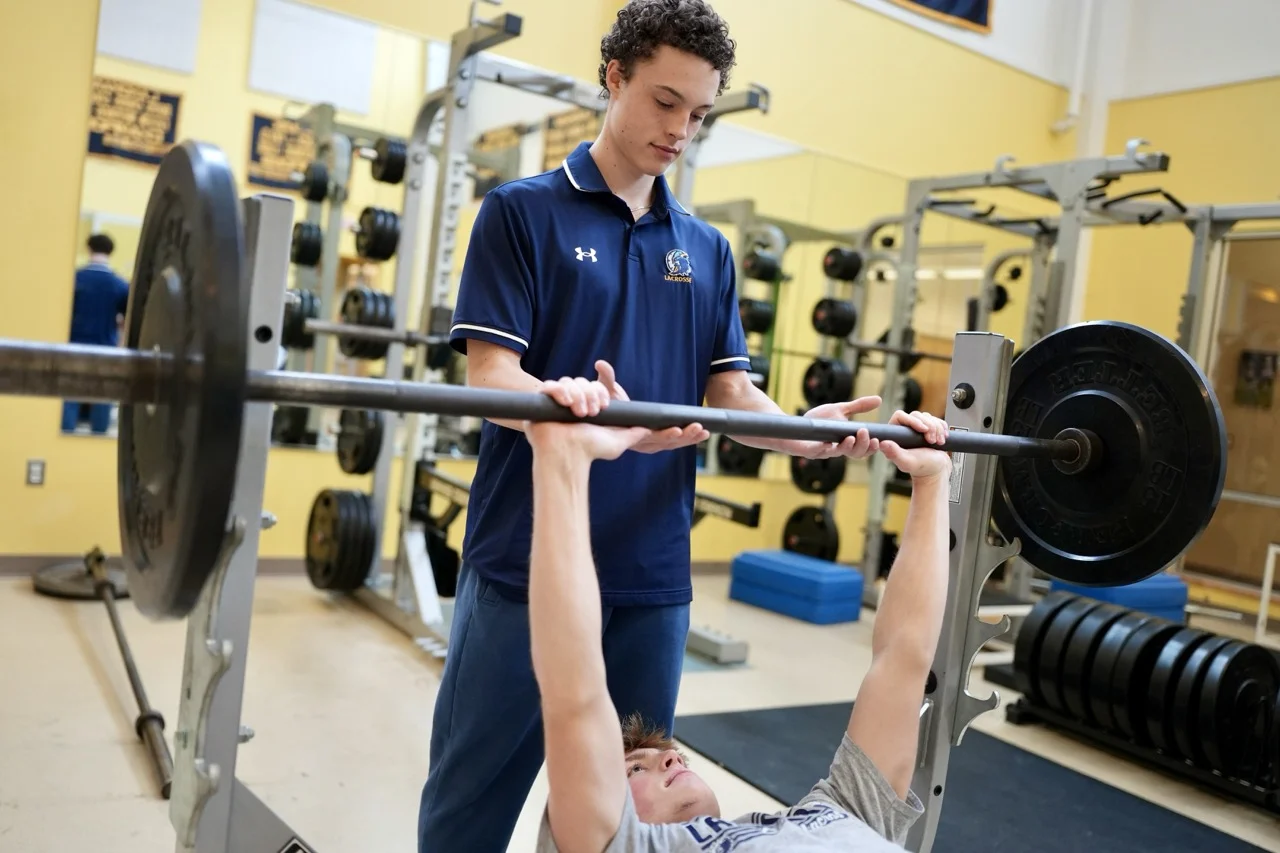 two boys in weightroom