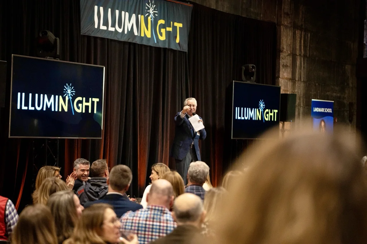 fundraiser auctioneer on stage