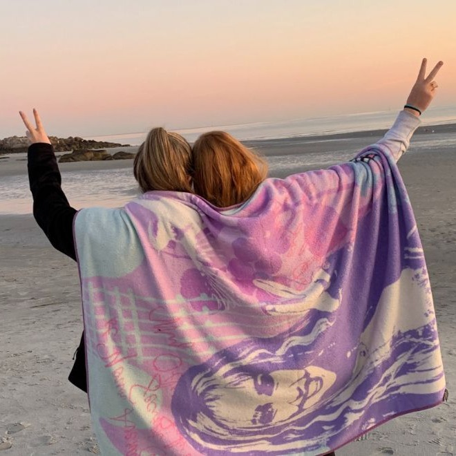 students on the beach at sunrise