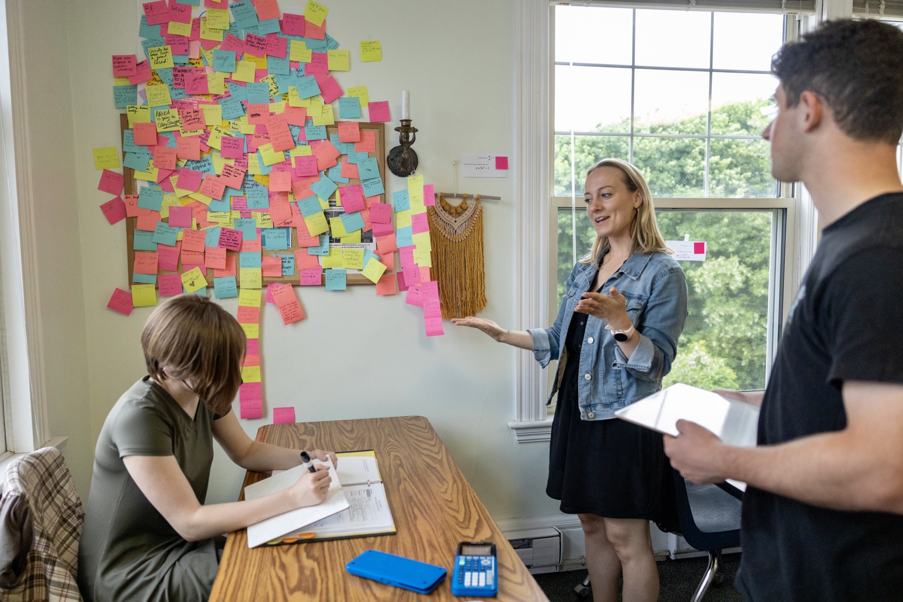 teacher in classroom talking to students