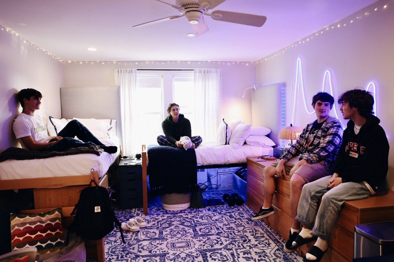 boys hanging out in boarding dorm