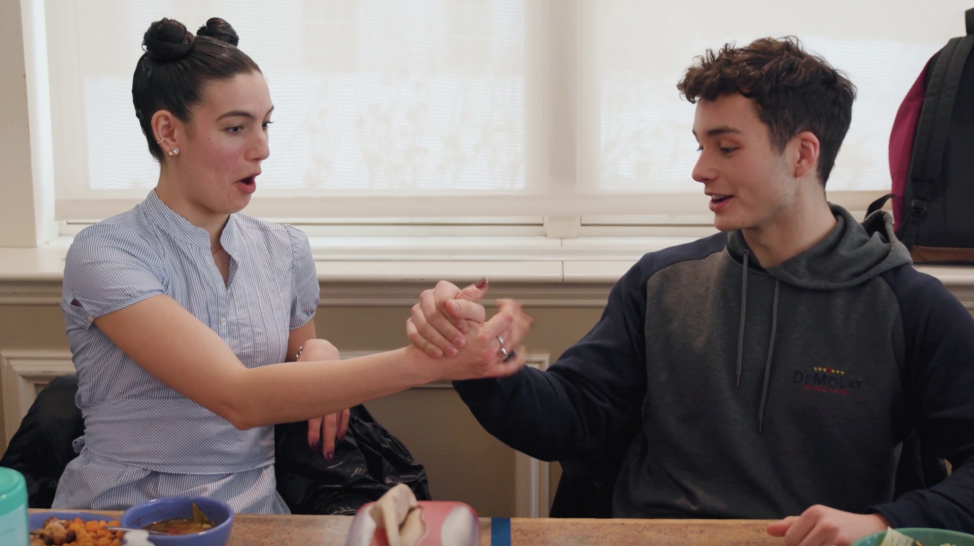 students handshaking