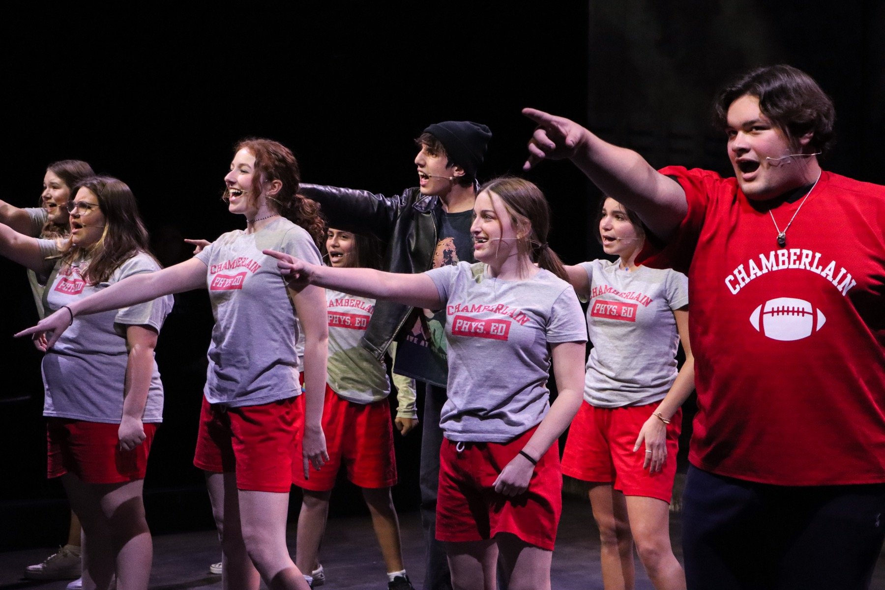 students performing on stage