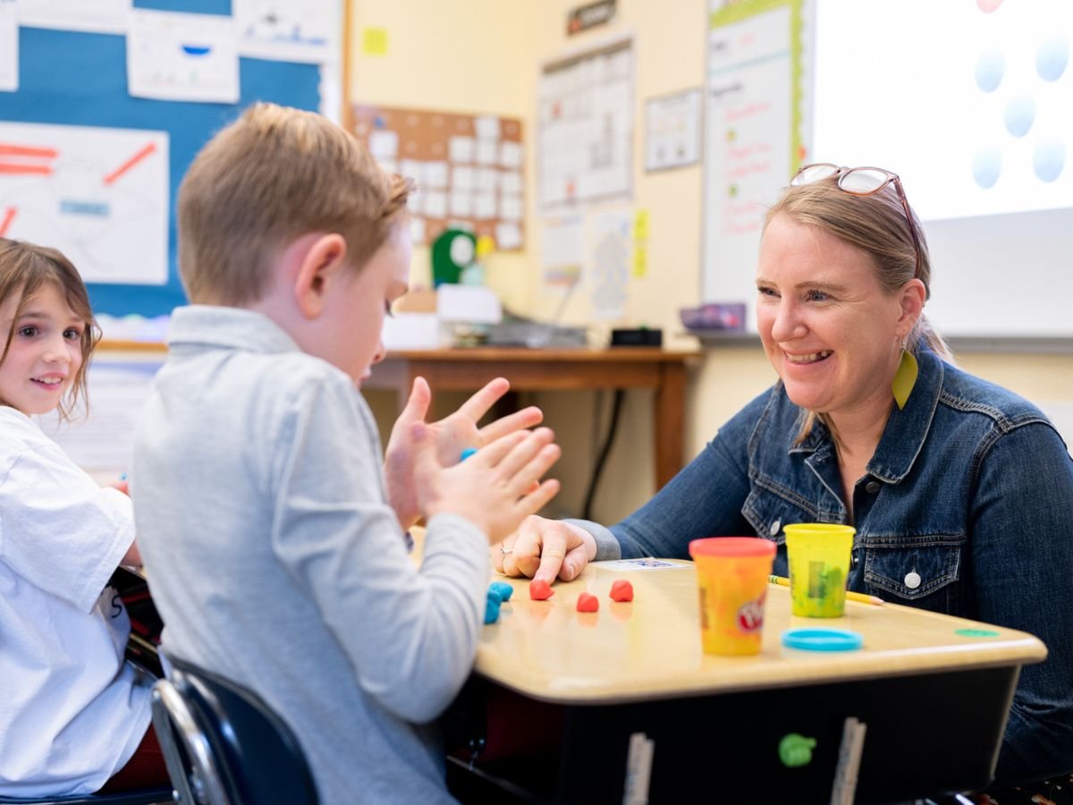 teacher and student in classroom