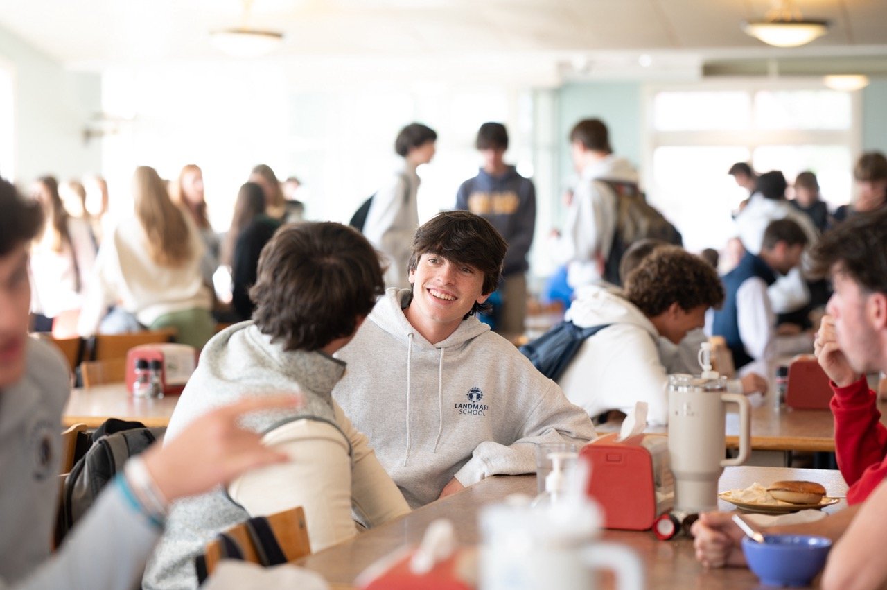 students eating food in a dining hall