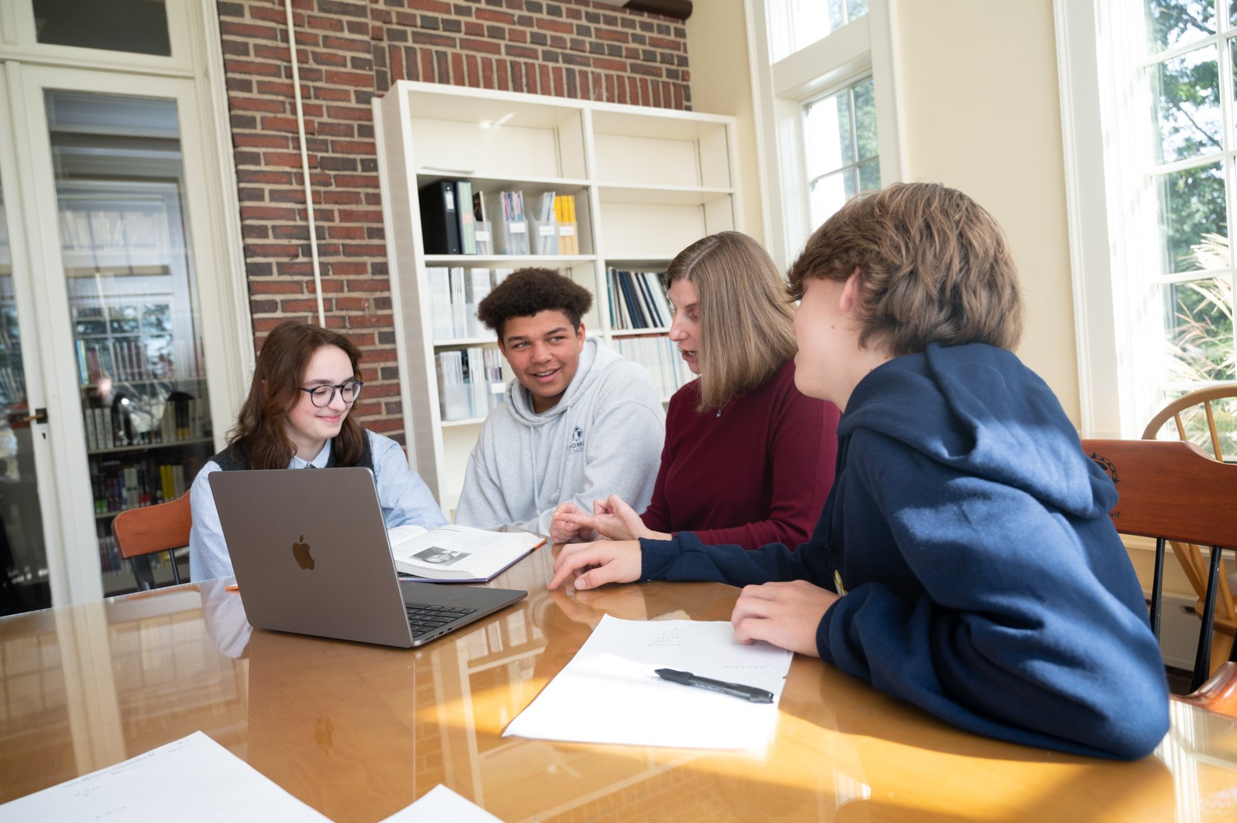 small group of students in a class with a teacher