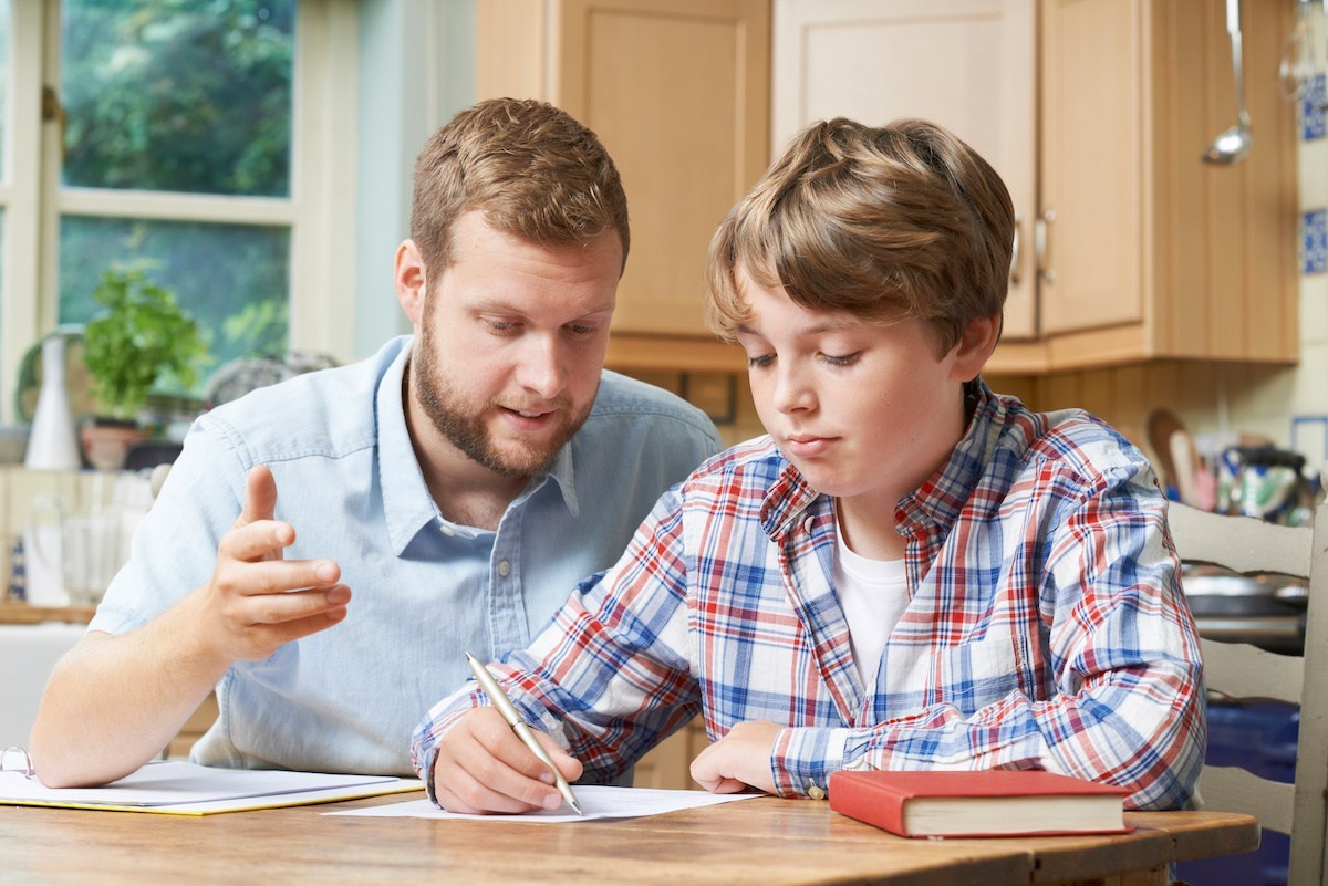 father and son working on homework