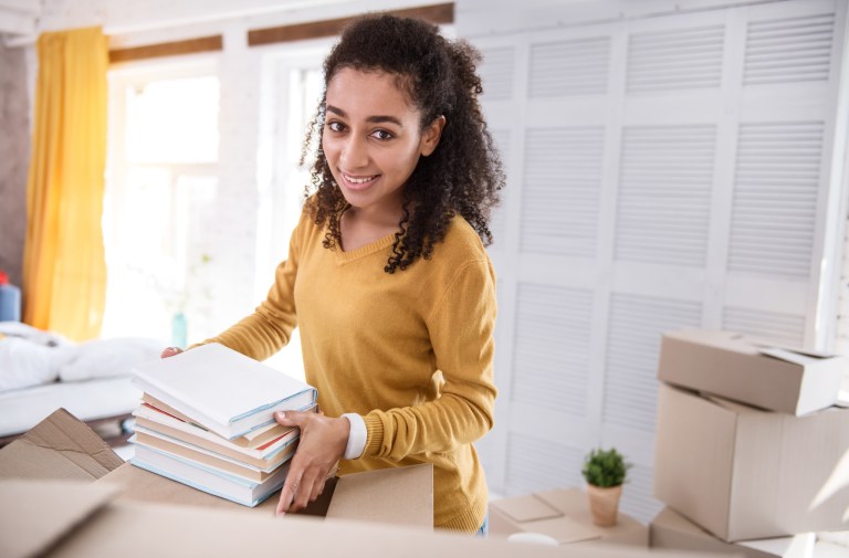 girl moving books