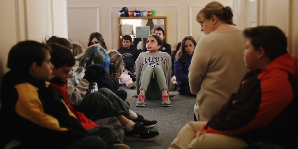 elementary students meditating