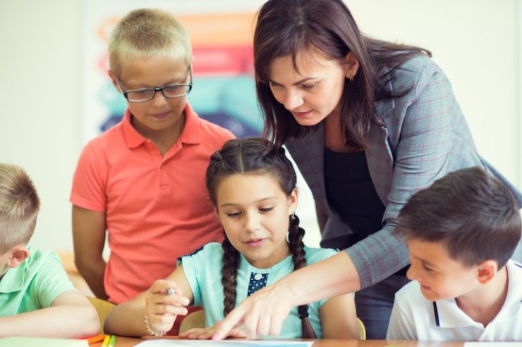 teacher and students working