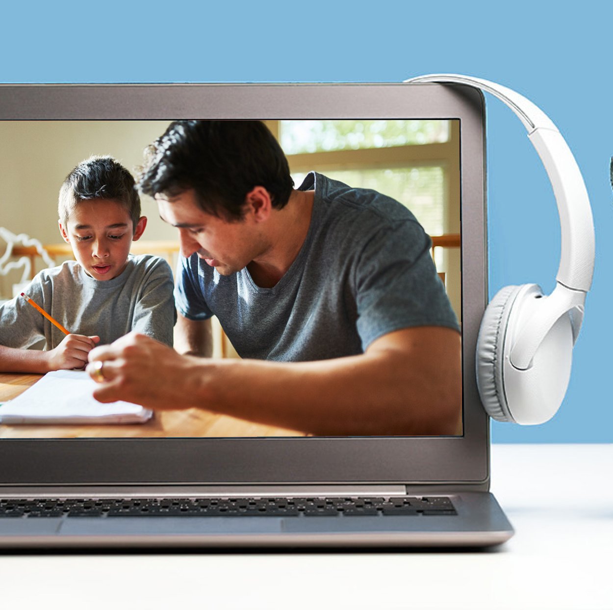 computer screen with headphones and parent working with child