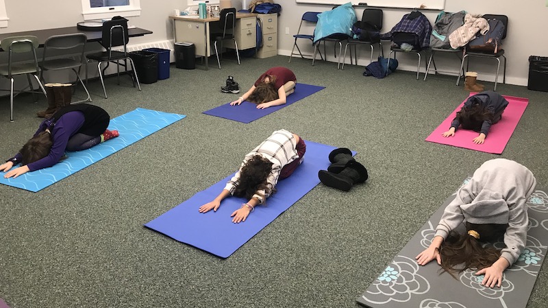 students doing yoga