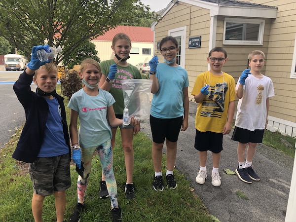 landmark elementary middle school students picking up trash on campus