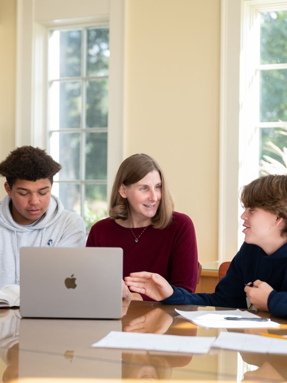 teacher working with students