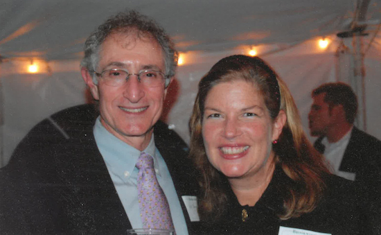 bob and maida broudo smiling under a tent