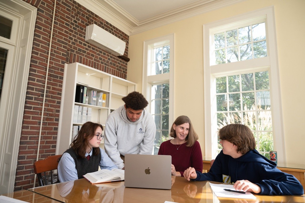 students working with librarian