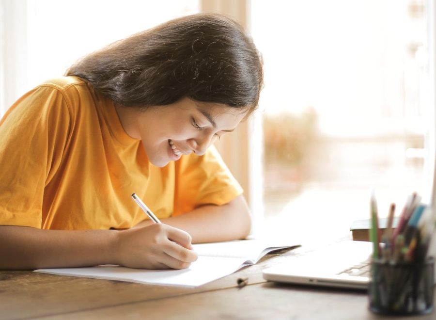 girl working on executive function skills during summer workshop